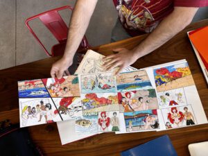 Student showcasing their manga drawings