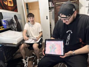 Students showcasing their manga drawings